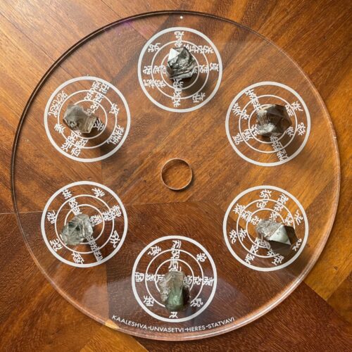 6 smokey quartz crystal points with mineral inclusions on the Urusak Water Device main plate