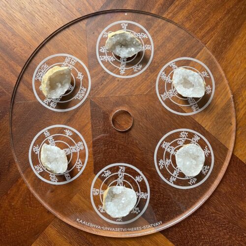 6 geodes with clear quartz crystals on the Urusak Water Device main plate